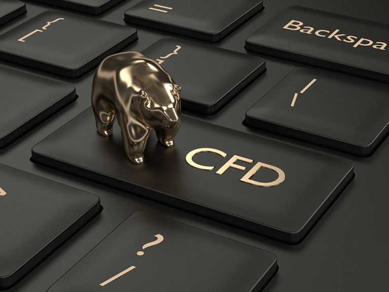 Golden bear figurine on the button of the keyboard "CFD"