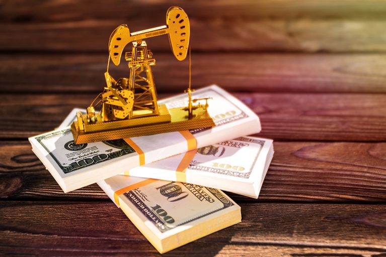 Figurine oil rig on a stack of cache