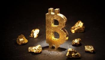 El símbolo de BTC junto a piedras de oro. Imagen conceptual de Bitcoin Gold.